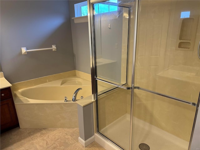 bathroom with vanity, tile patterned flooring, and separate shower and tub