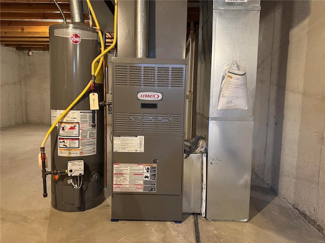 utility room featuring water heater