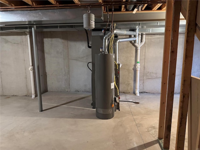 unfinished basement featuring gas water heater