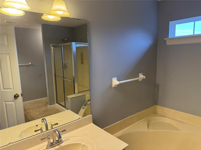 full bath with a garden tub, vanity, a shower stall, and visible vents