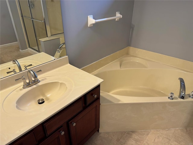 bathroom with tile patterned flooring, a shower stall, a bath, and vanity