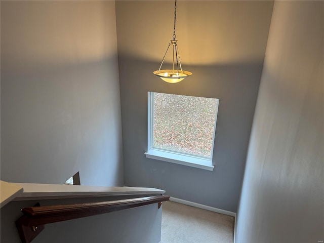 stairway with carpet and baseboards