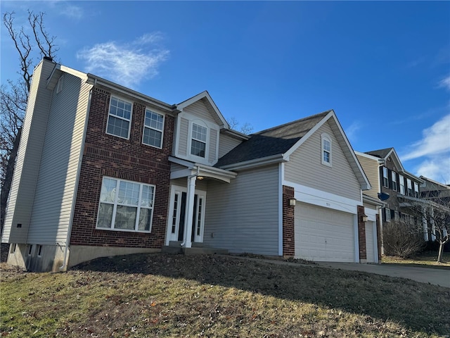 traditional home with an attached garage, a chimney, concrete driveway, and brick siding