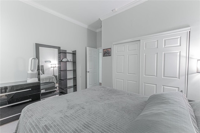 bedroom with ornamental molding and a closet