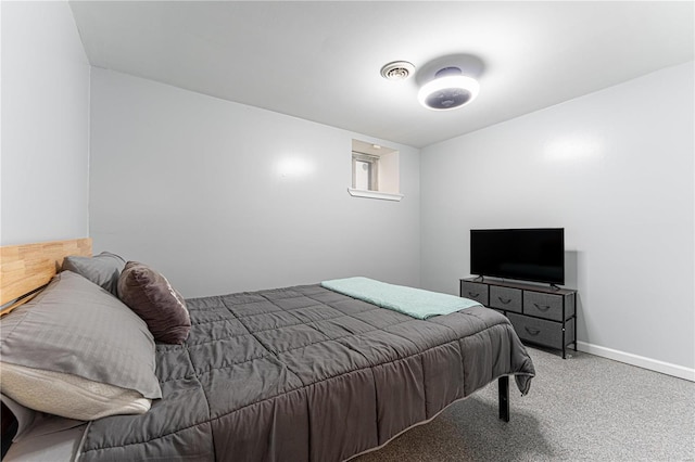 bedroom with carpet, visible vents, and baseboards