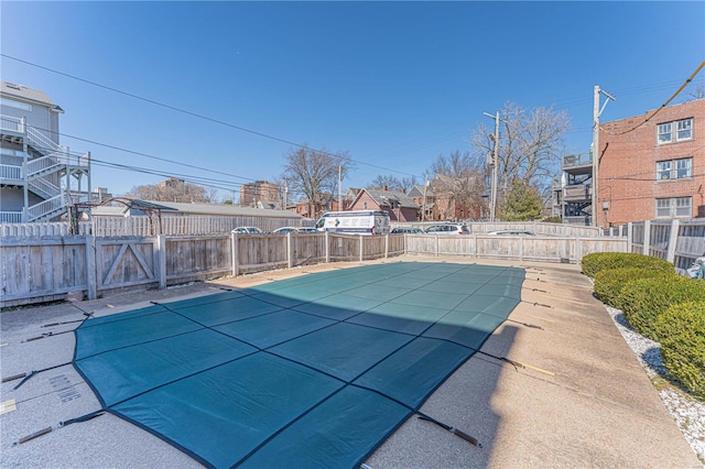 view of pool with fence