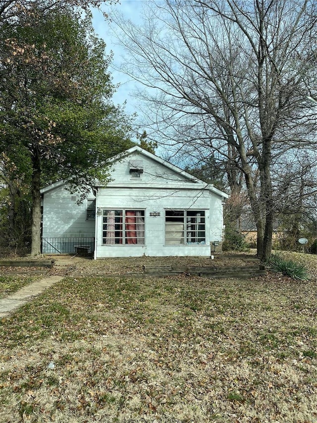 exterior space with a front lawn