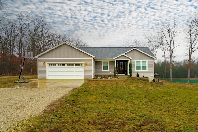 view of front of house with a garage and a front yard