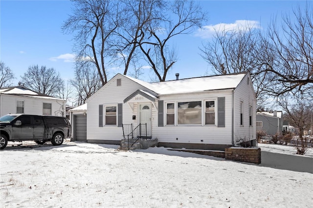 bungalow-style house with a garage