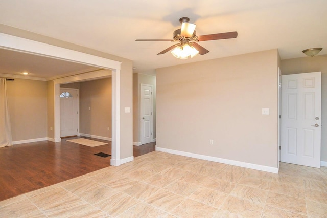 unfurnished room with ceiling fan