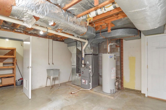 basement featuring water heater and heating unit