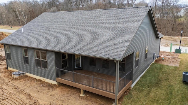 rear view of property with a lawn