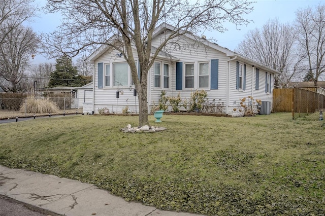 view of front of property featuring central AC unit and a front lawn