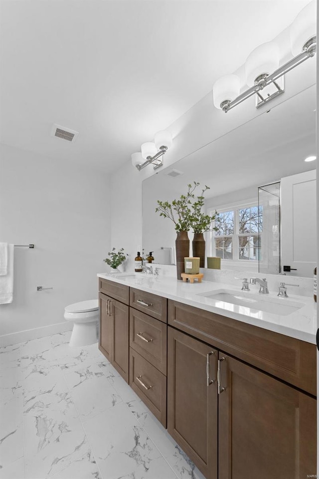 full bathroom featuring visible vents, toilet, marble finish floor, a shower stall, and a sink