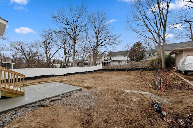 view of yard featuring a patio area and fence