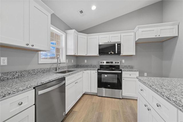 kitchen featuring white cabinetry, stainless steel appliances, and a sink