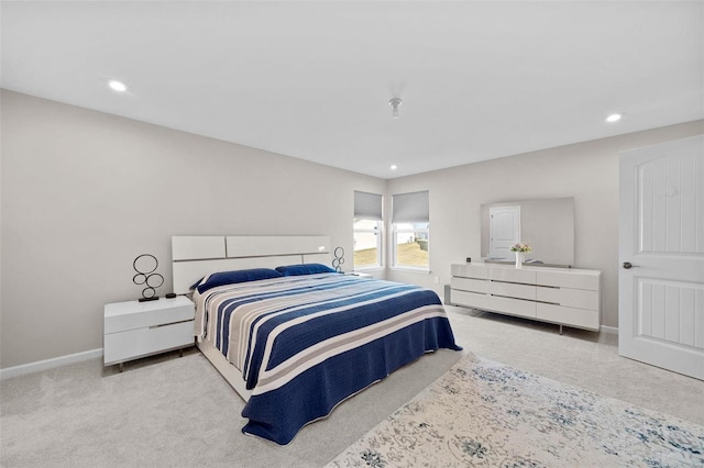 bedroom with recessed lighting, baseboards, and carpet floors