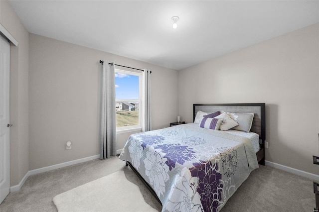 bedroom with carpet and baseboards