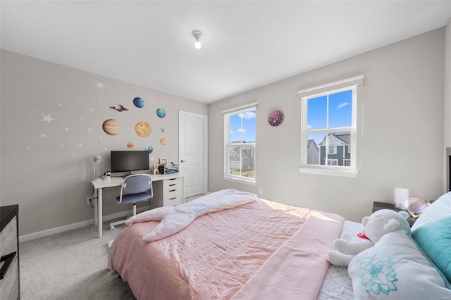 carpeted bedroom with baseboards