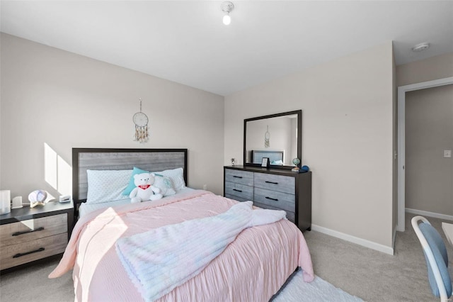 carpeted bedroom with baseboards