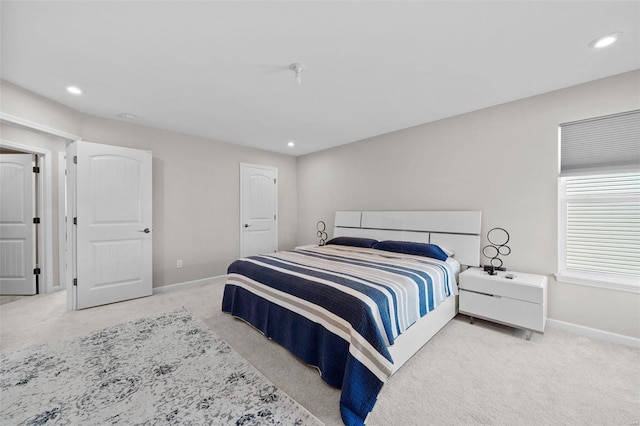 carpeted bedroom with recessed lighting and baseboards