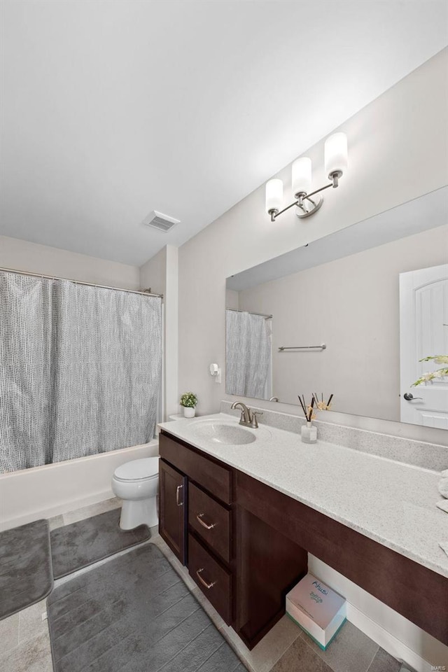 bathroom featuring visible vents, toilet, vanity, and shower / bath combination with curtain