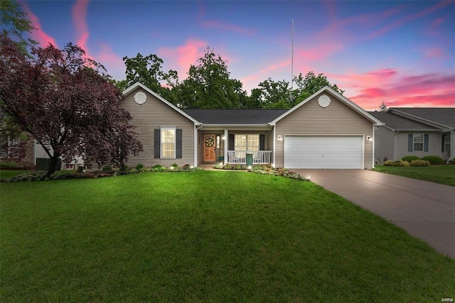 ranch-style home with a garage, concrete driveway, covered porch, and a lawn