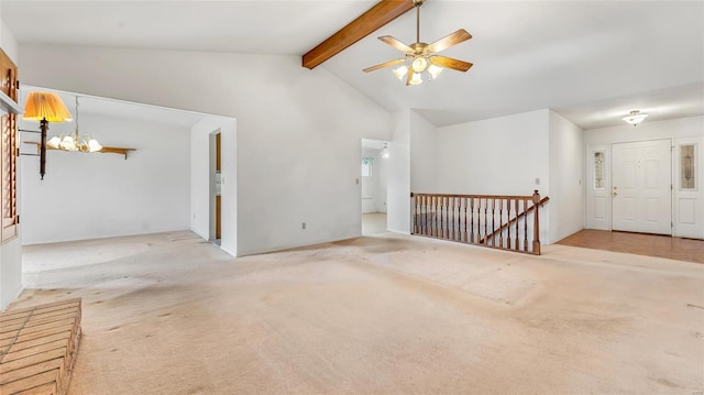 unfurnished living room with beamed ceiling, ceiling fan with notable chandelier, light carpet, and high vaulted ceiling