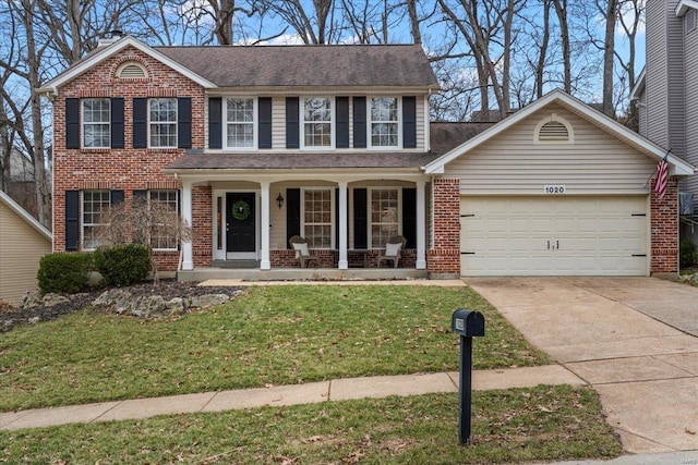 view of front of property featuring brick siding, covered porch, concrete driveway, and a garage