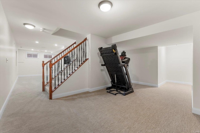 exercise room featuring recessed lighting, visible vents, baseboards, and carpet