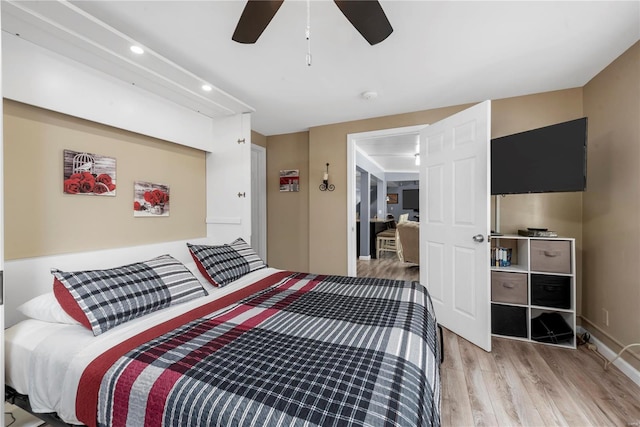 bedroom featuring ceiling fan, light wood-style flooring, and recessed lighting