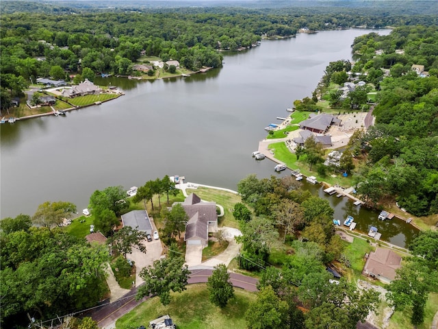 aerial view featuring a water view, a residential view, and a view of trees