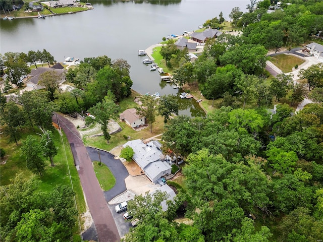 drone / aerial view with a water view and a residential view