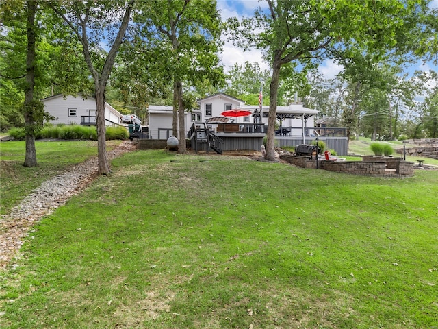 view of yard featuring a wooden deck