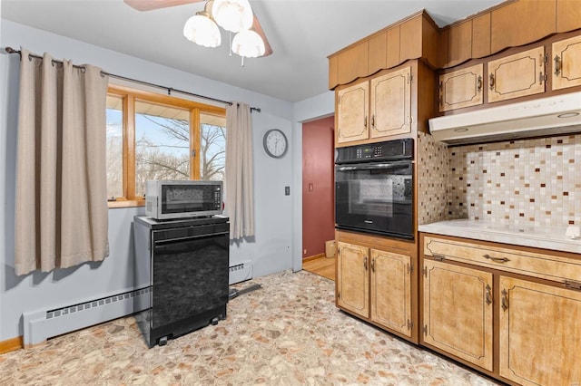 kitchen with cooktop, a baseboard radiator, oven, and decorative backsplash