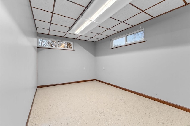 basement featuring a drop ceiling