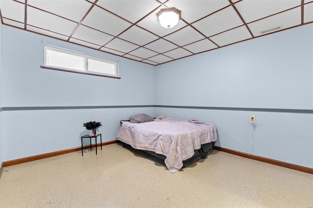 bedroom with a drop ceiling