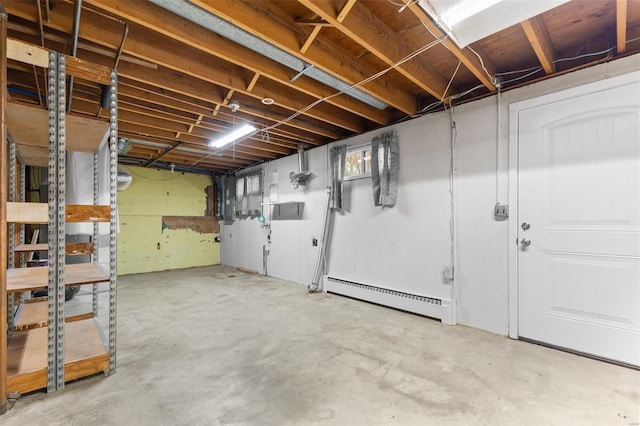 basement featuring a baseboard radiator