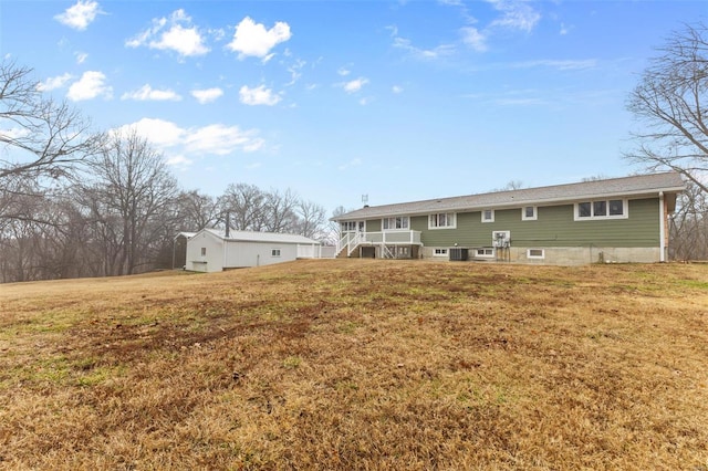 back of property featuring a yard