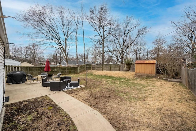 view of yard featuring an outbuilding, a fenced backyard, outdoor lounge area, a storage shed, and a patio area