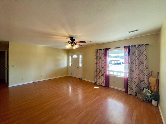 interior space featuring hardwood / wood-style flooring and ceiling fan