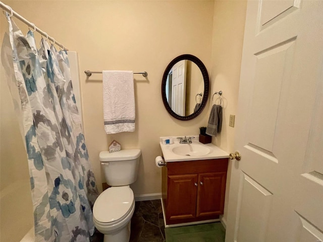 bathroom featuring vanity, toilet, and a shower with curtain