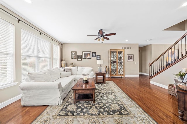 living room with hardwood / wood-style floors and ceiling fan