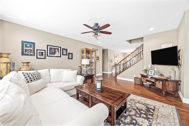 living room with wood-type flooring and ceiling fan