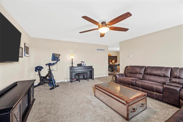 living room featuring ceiling fan and light colored carpet