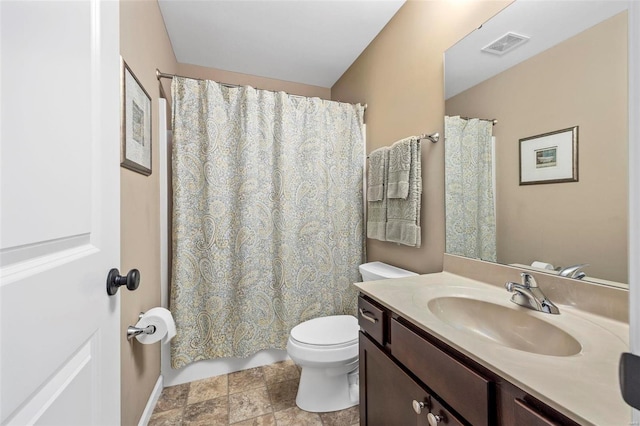 full bath featuring visible vents, toilet, vanity, and shower / bath combo