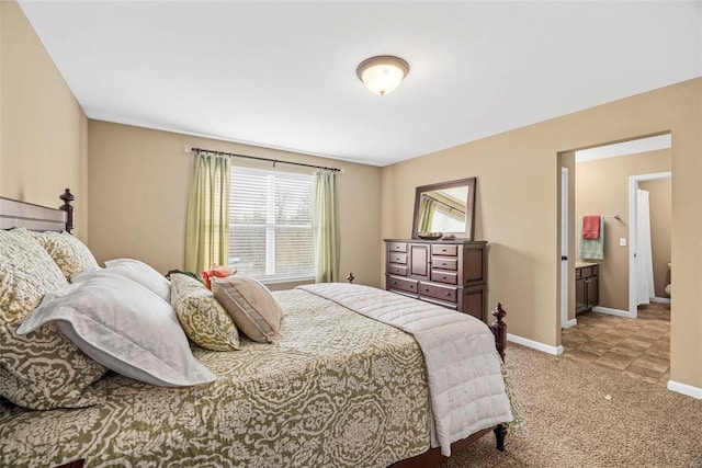 bedroom with light colored carpet and baseboards