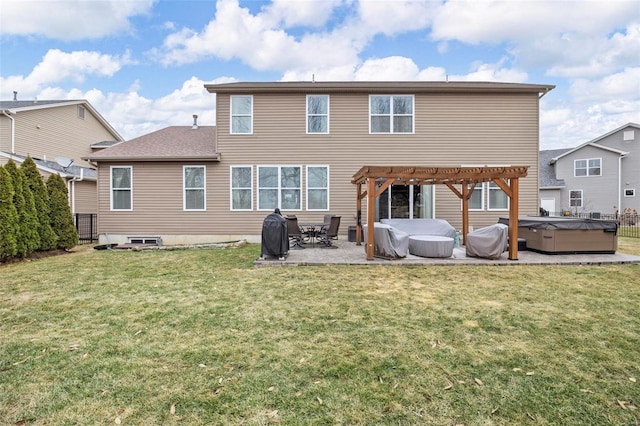 rear view of house with a patio, a yard, a pergola, and a hot tub