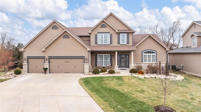 craftsman inspired home featuring driveway, roof with shingles, covered porch, and a front lawn