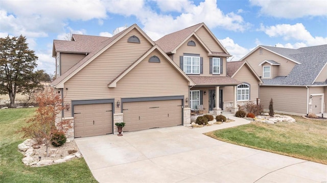 craftsman house featuring concrete driveway, a front yard, and a shingled roof